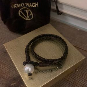 Vincent Peach bracelet. Never worn. Braided leather with pearl loop clasp.